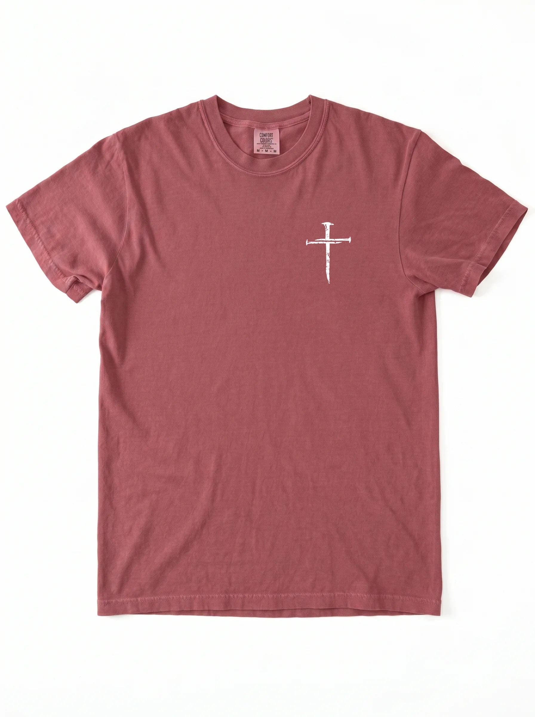 A short-sleeve crewneck t-shirt in a dusty rose or mauve color, featuring a small white graphic of on the left chest, laid flat against a white background.