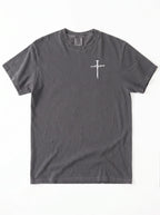 A dark gray crewneck t-shirt with a small white graphic of a cross on the left chest, displayed flat against a white background.