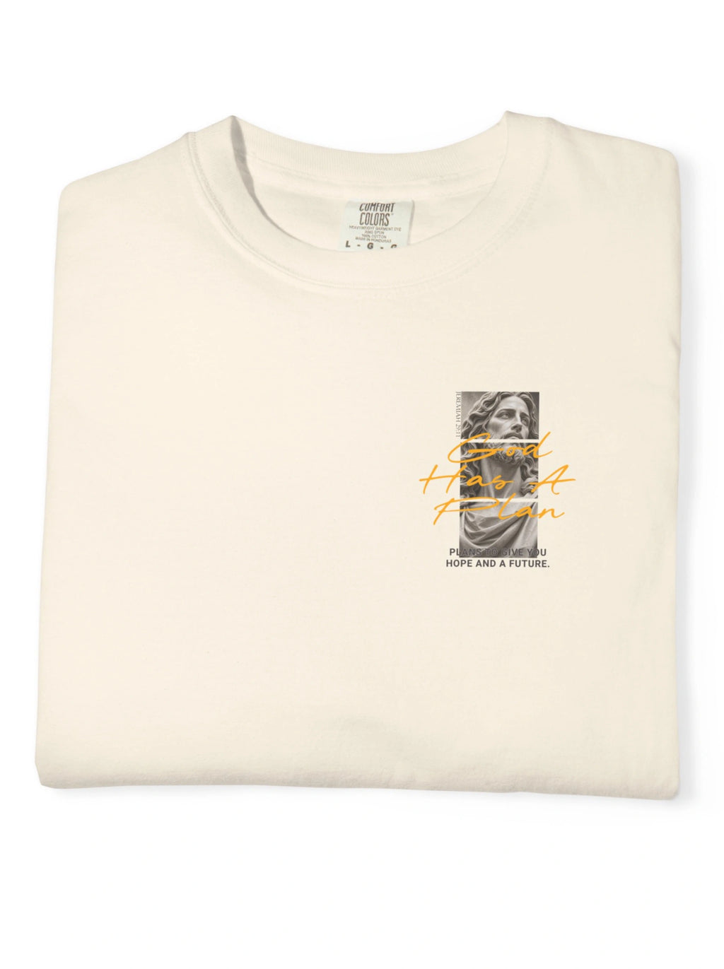 Folded cream T-shirt showing a statue graphic and the text “God Has A Plan” and “Plans to give you hope and a future.”