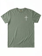 An olive green short-sleeve t-shirt with a small white nail-and-sword graphic printed on the left chest, displayed flat against a white background.