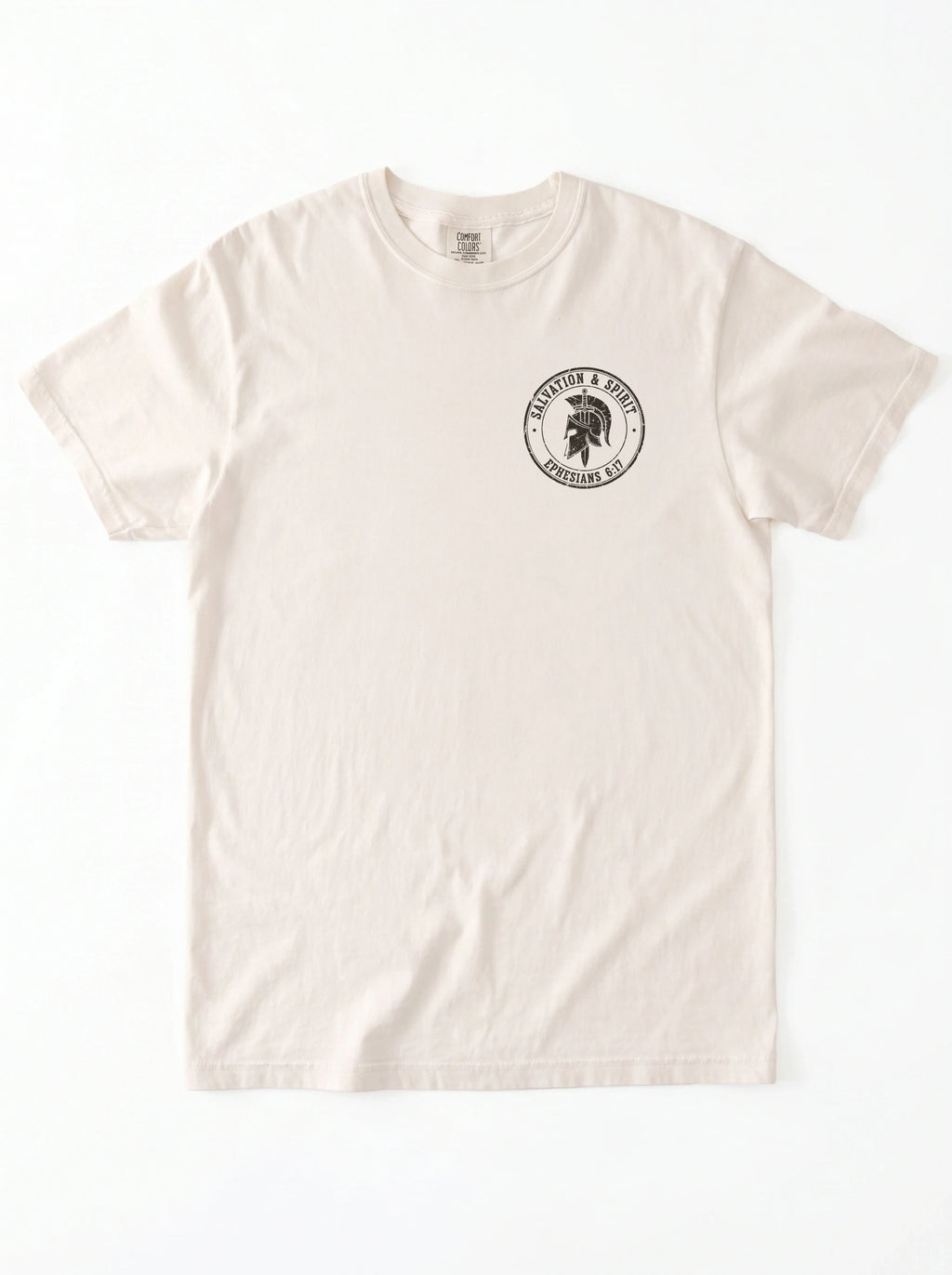 A cream-colored short-sleeve crewneck t-shirt with a circular black graphic on the left chest featuring a black circular graphic on that reads 'Salvation & Spirit Ephesians 6:17' around a helmet design.