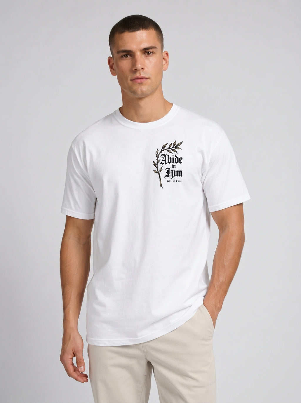 White T-shirt with a leafy chest graphic reading “Abide in Him” and “John 15:4.”