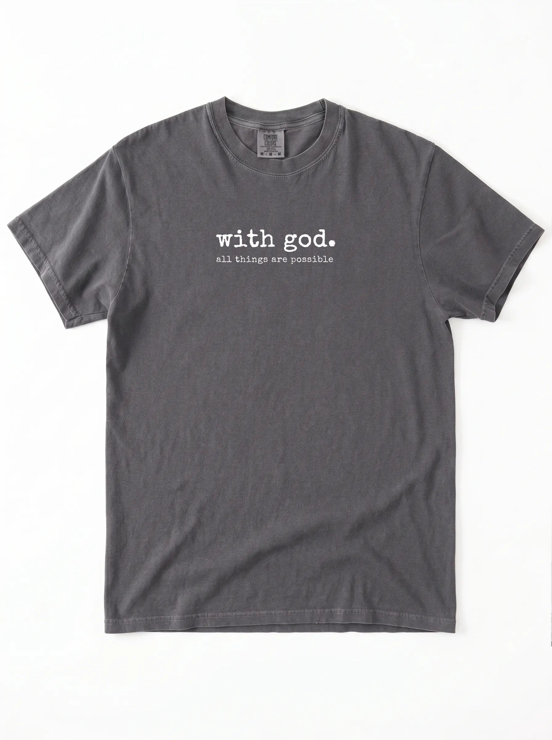 A dark gray crewneck t-shirt with white printed text on the chest reading 'with god. all things are possible', displayed flat against a white background.