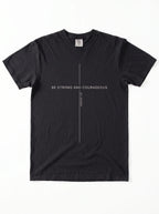 A black short-sleeve crewneck t-shirt with a minimalist white graphic on the chest featuring a vertical line and the text 'BE STRONG AND COURAGEOUS' and 'Joshua 1:9'
