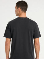 Person shown from behind wearing a plain black T-shirt.