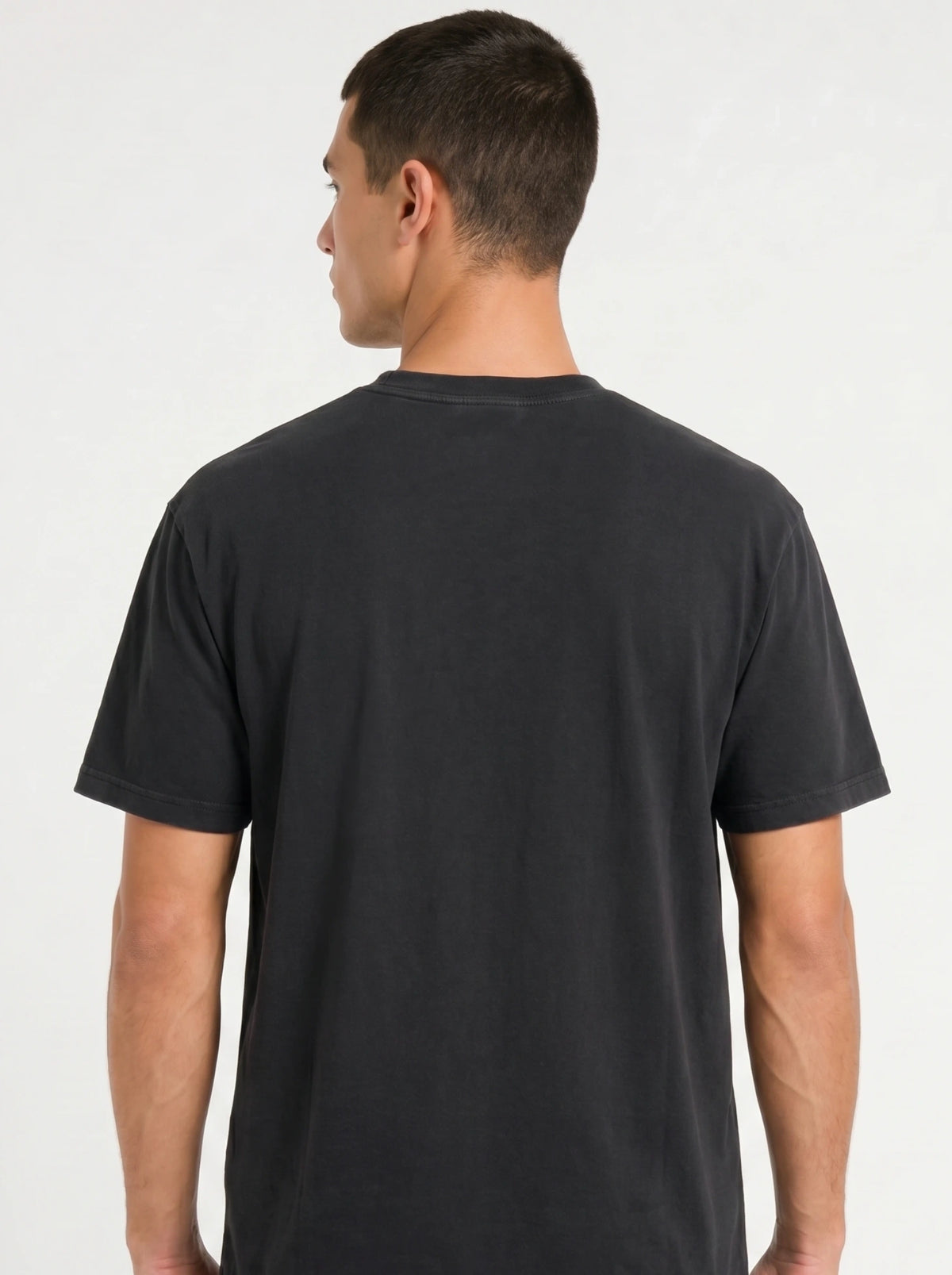Person shown from behind wearing a plain black T-shirt.
