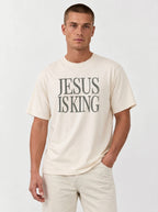 Man wearing an ivory Comfort Colors garment-dyed Jesus Is King t-shirt with a faith-based graphic tee design