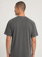 Back view of a person wearing a plain charcoal T-shirt with no visible design.