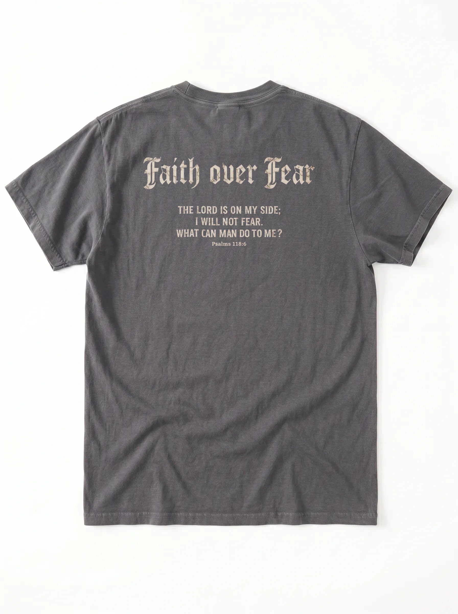 A dark gray t-shirt shown from the back, featuring a distressed cream-colored text graphic that reads 'Faith over Fear' followed by a Bible verse from Psalms 118:6.