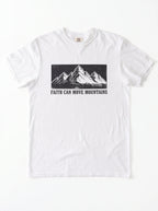 A white short-sleeve crewneck t-shirt featuring a black graphic of a mountain range and the text 'FAITH CAN MOVE MOUNTAINS' printed on the chest.