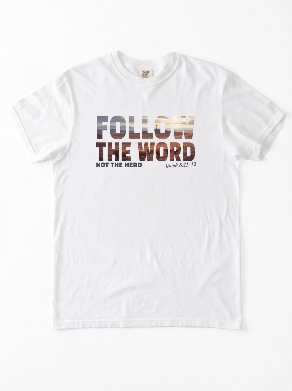 A white short-sleeve crewneck t-shirt with a graphic print on the chest reading 'FOLLOW THE WORD NOT THE HERD' and 'Isaiah 8:11-13' in a textured, multi-toned font.