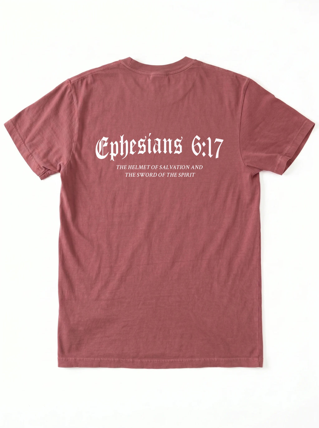 A dusty rose short-sleeve t-shirt shown from the back, featuring the text 'Ephesians 6:17' in a white Gothic font, with smaller white text underneath reading 'THE HELMET OF SALVATION AND THE SWORD OF THE SPIRIT'. The shirt is laid flat against a clean white background.