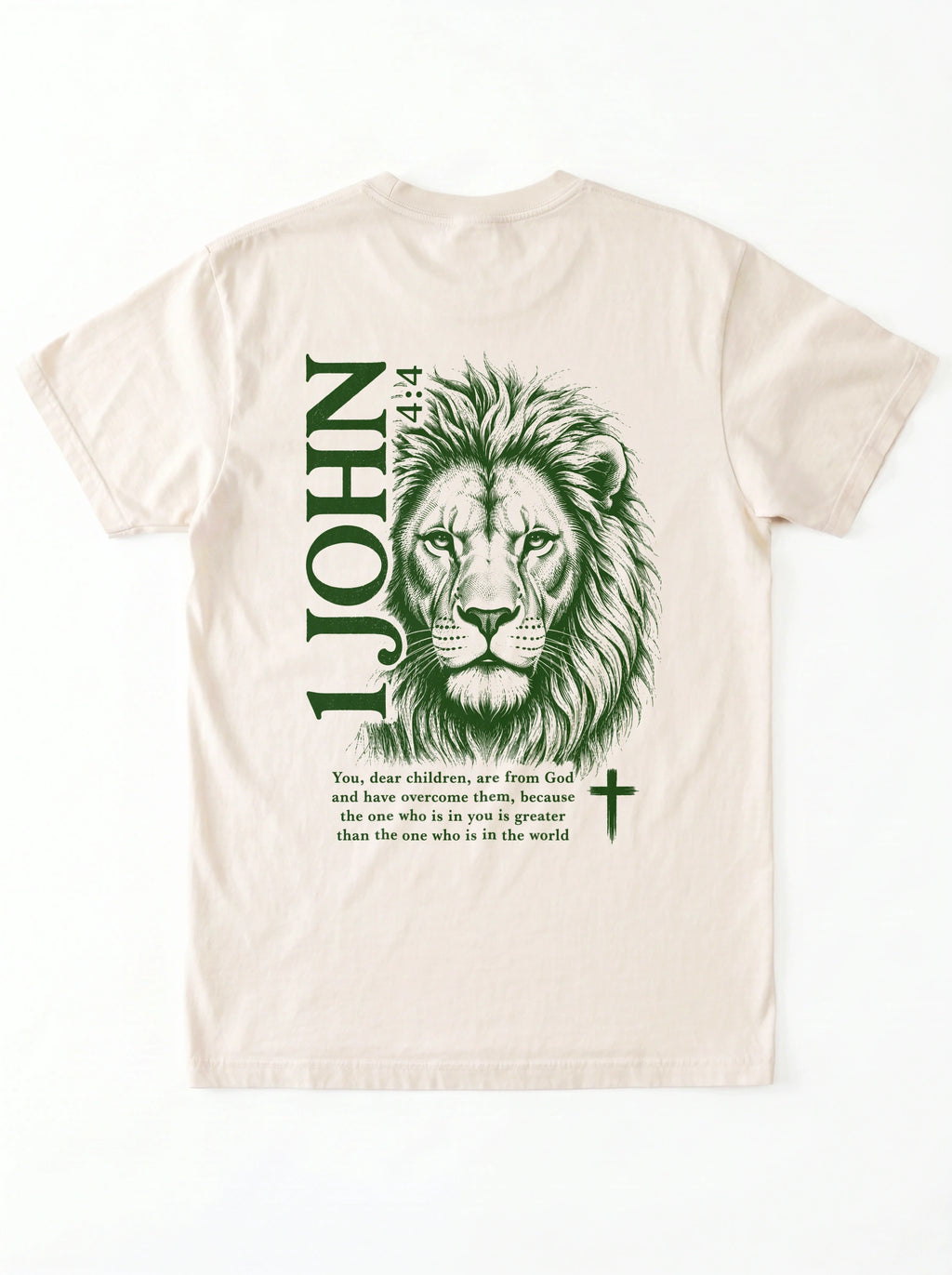 Back of a cream T-shirt with a green lion illustration, cross, “1 John 4:4,” and the verse text, “You, dear children, are from God and have overcome them, because the one who is in you is greater than the one who is in the world.”