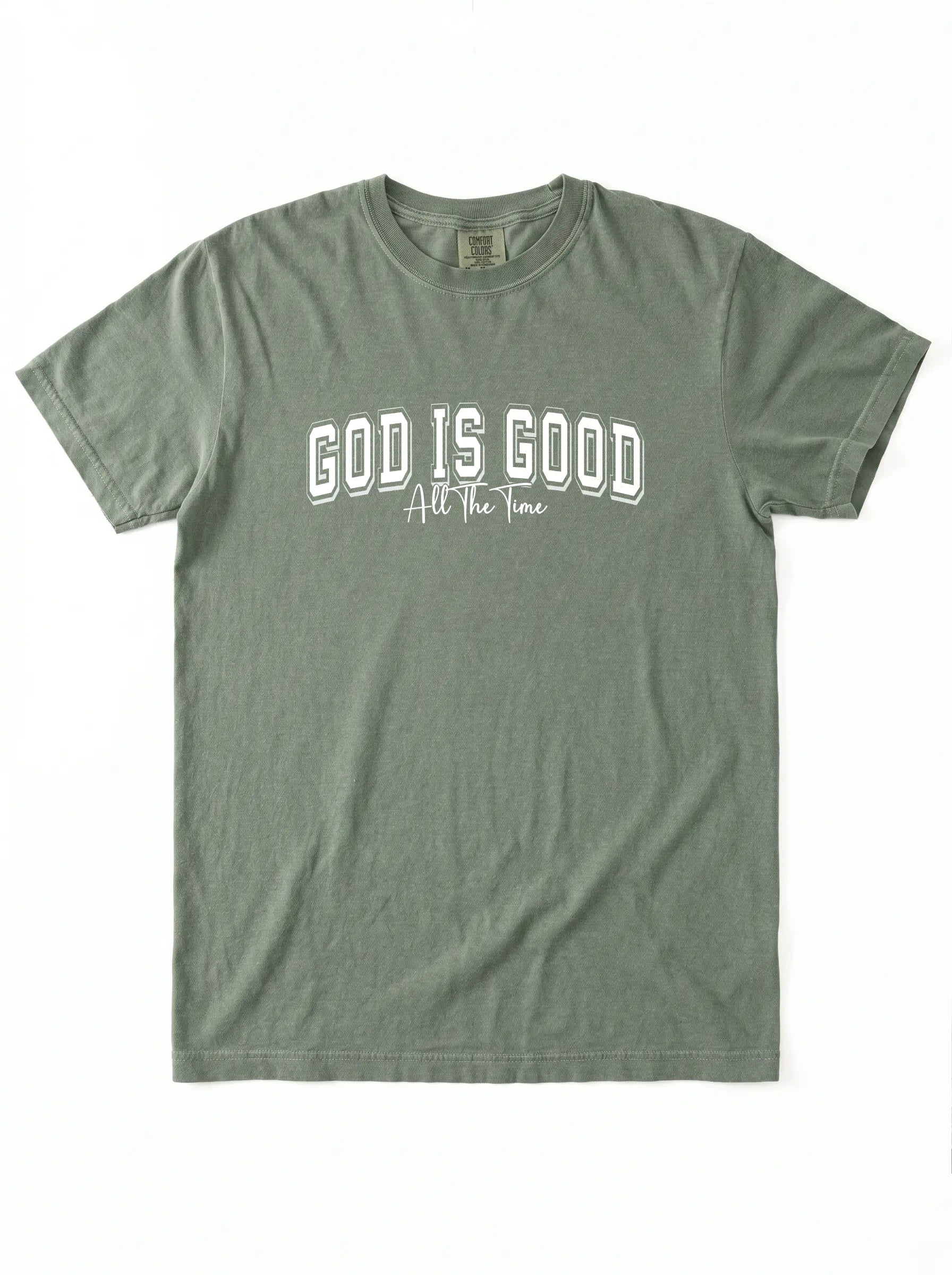 An olive green short-sleeve t-shirt with 'GOD IS GOOD All The Time' printed in white across the chest, displayed flat against a white background.