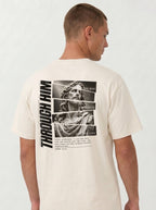 Person turned slightly sideways wearing a cream T-shirt with a grayscale Jesus graphic, “Through Him,” “The Way, The Truth, And The Life,” and John 14:6 text.
