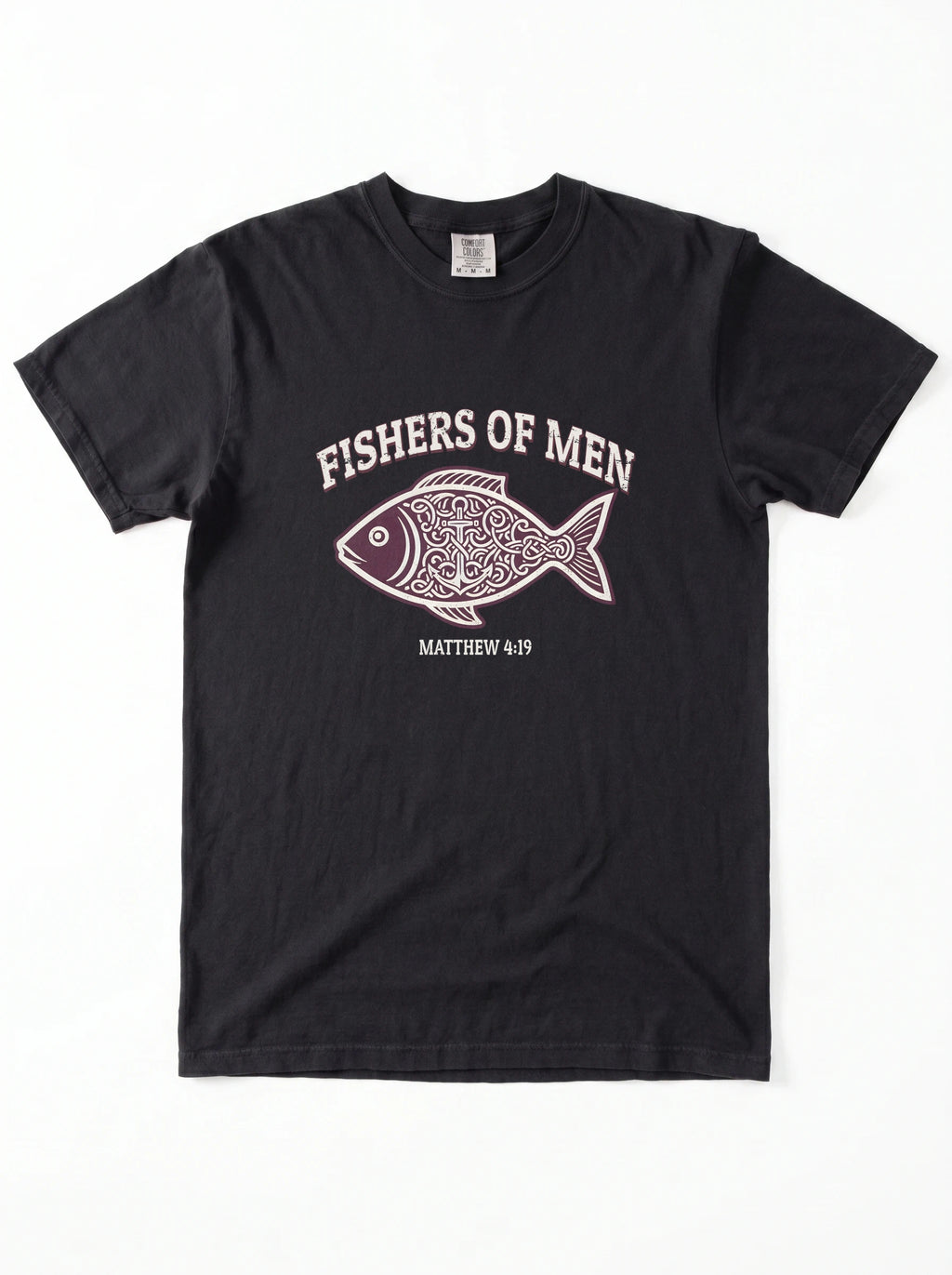 A black short-sleeve crewneck t-shirt featuring a graphic print of a patterned fish with the text 'FISHERS OF MEN' and 'MATTHEW 4:19' printed in white and light pink.
