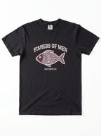 A black short-sleeve crewneck t-shirt featuring a graphic print of a patterned fish with the text 'FISHERS OF MEN' and 'MATTHEW 4:19' printed in white and light pink.