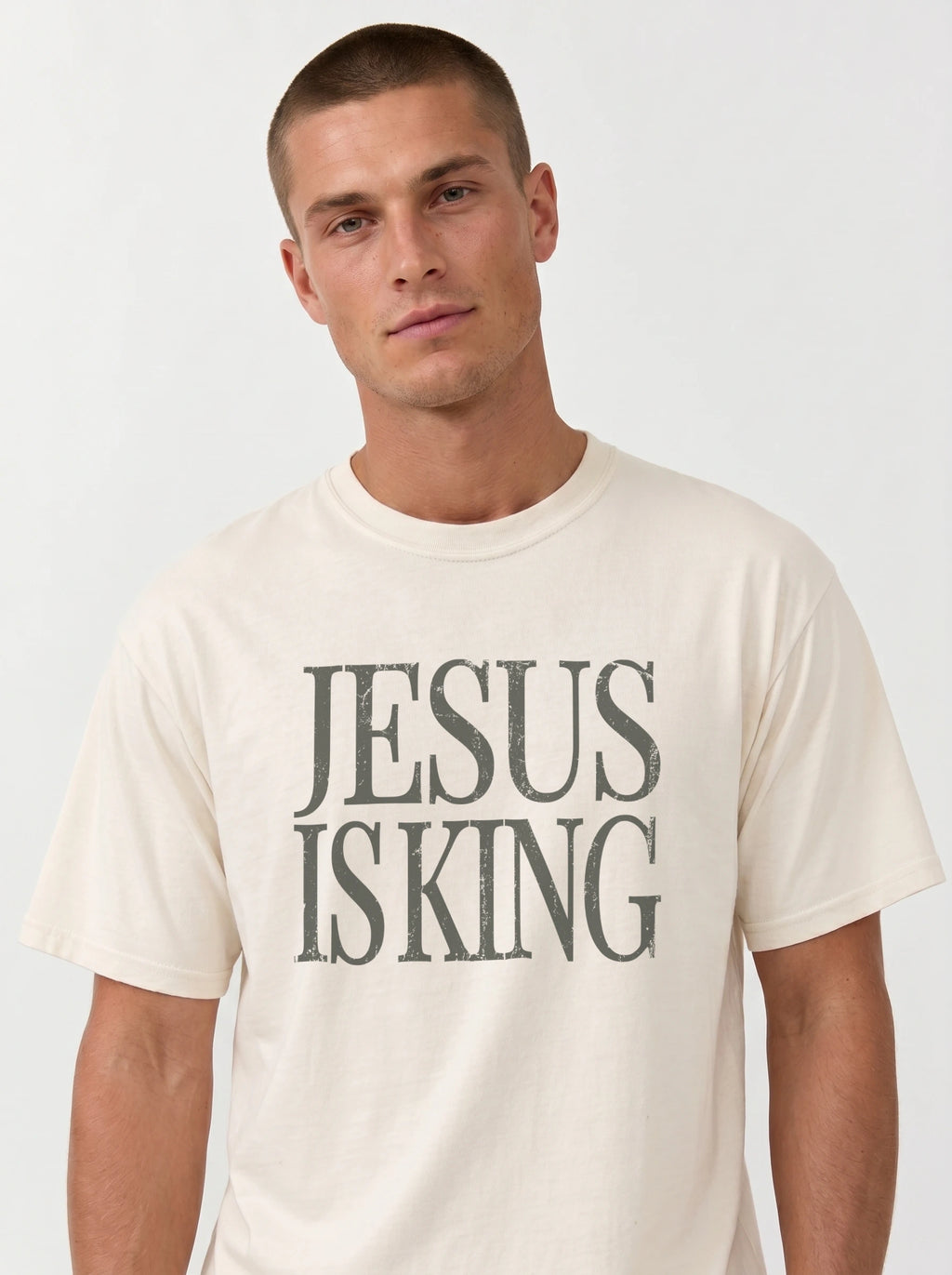 Close-up of Jesus Is King graphic print on ivory Comfort Colors t-shirt chest