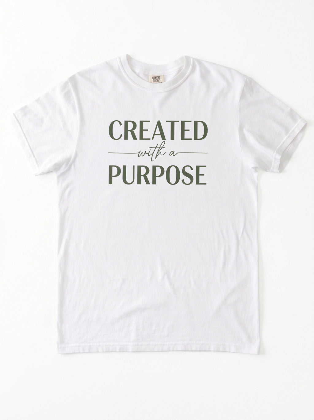 A white short-sleeve crewneck t-shirt with the text 'CREATED with a PURPOSE' printed in dark olive green on the chest, laid flat against a white background.