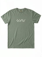 An olive green crewneck t-shirt with a white stylized 'God Is Greater Than Highs and Lows' logo printed across the chest, displayed flat against a white background.