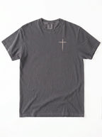 A dark gray crewneck t-shirt with cross printed in beige on the chest, laid flat against a white background.