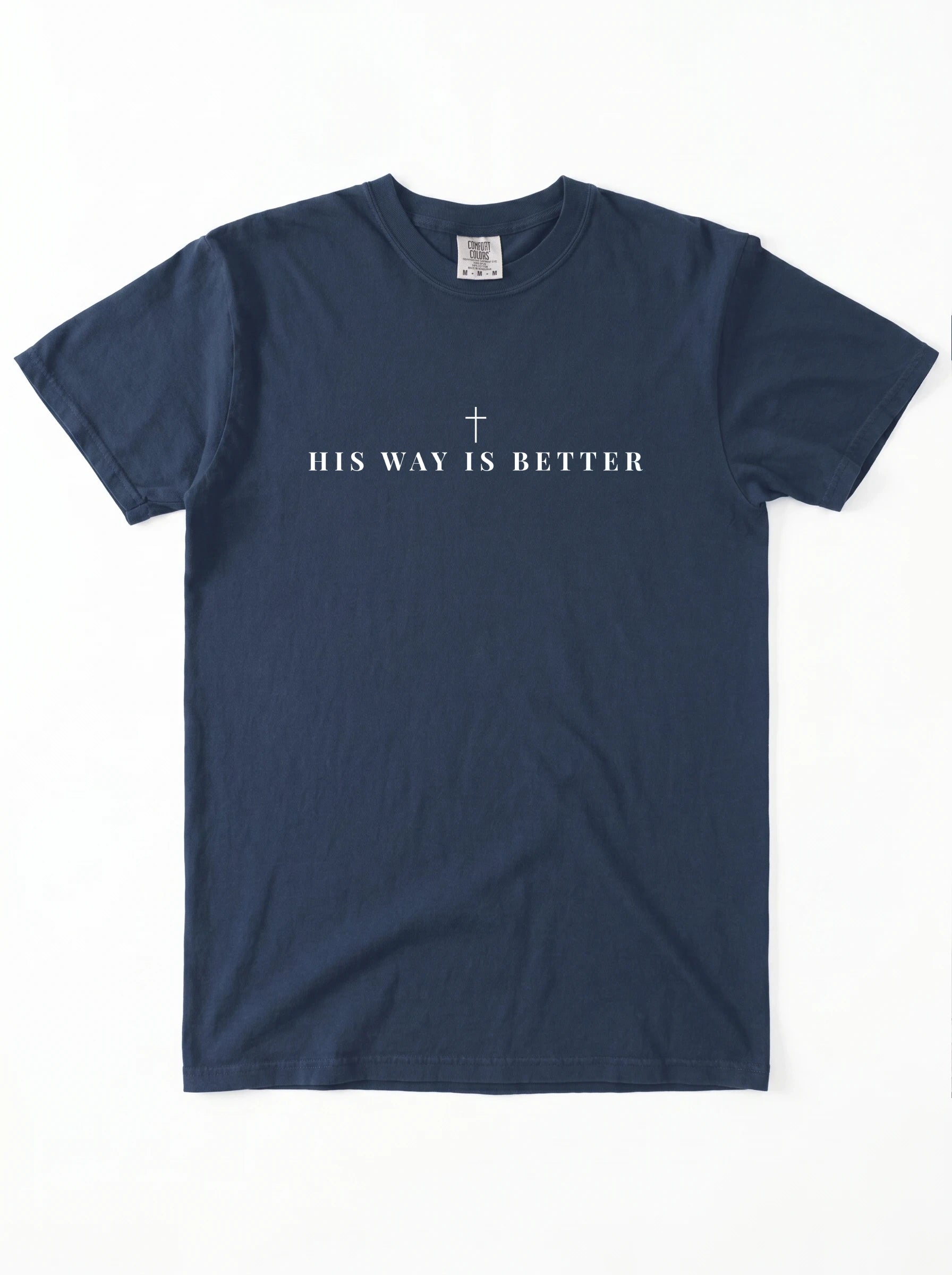 A navy blue short-sleeve crewneck t-shirt with the text 'HIS WAY IS BETTER' and a small cross printed in white on the chest, laid flat against a white background.