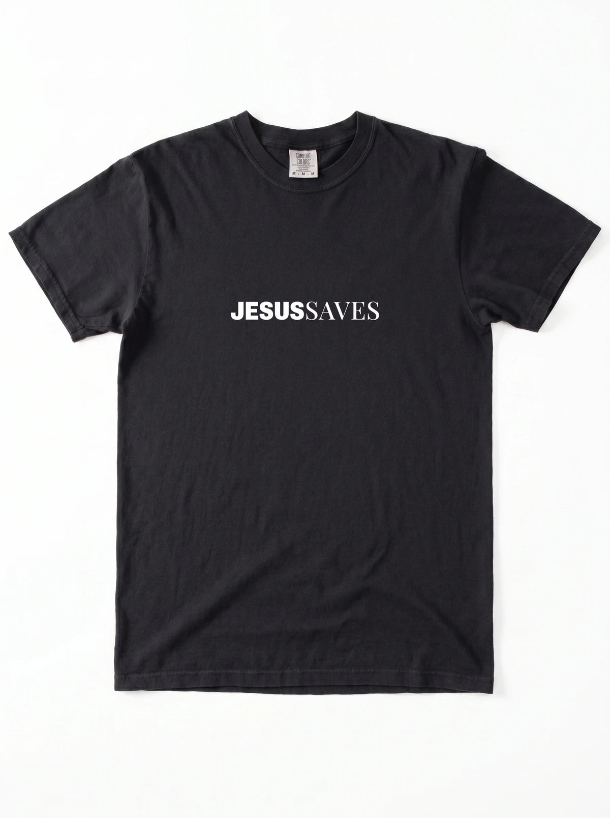 Black T-shirt laid flat with white chest text reading “Jesus Saves.”