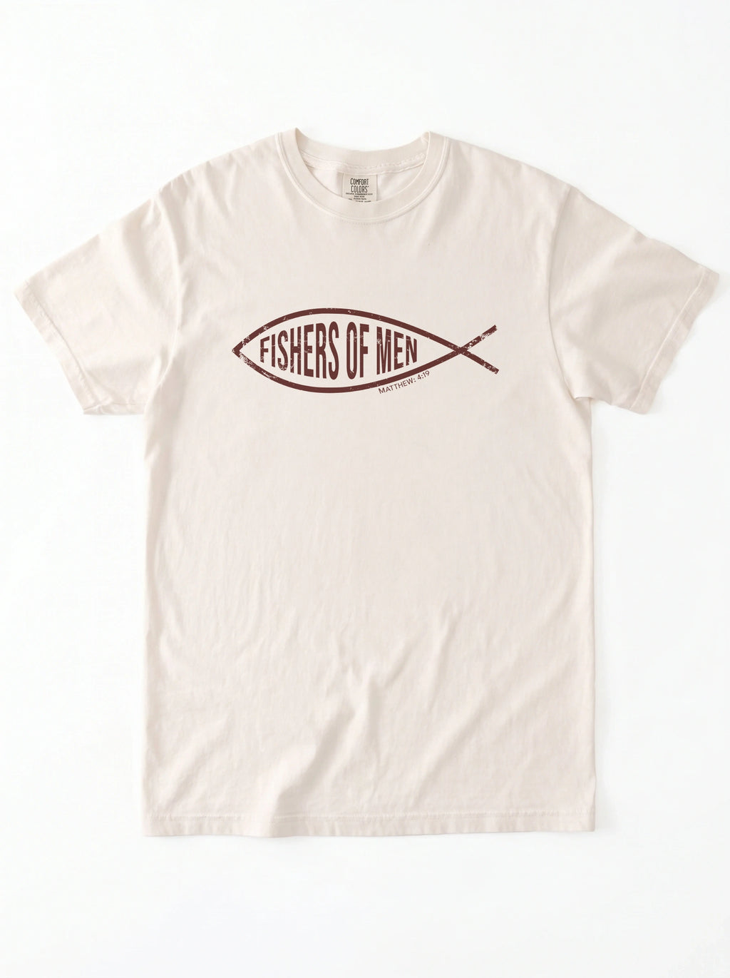 An off-white crewneck t-shirt featuring a dark brown graphic of a fish containing the text 'FISHERS OF MEN' on the chest, laid flat against a white background.