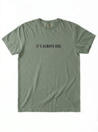 Muted green T-shirt laid flat with the black text “It’s Always God.”