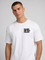 Person wearing a white T-shirt with a small distressed chest print reading “The Way The Truth The Life.”