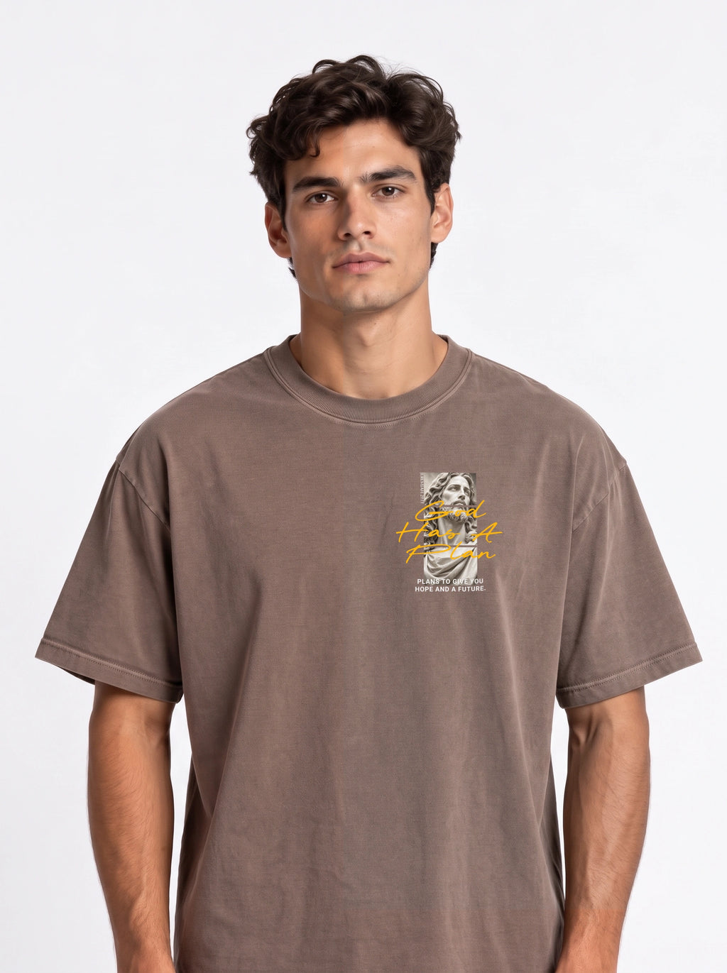 Person wearing a faded brown T-shirt with a statue graphic and the text “God Has A Plan” and “Plans to give you hope and a future.”