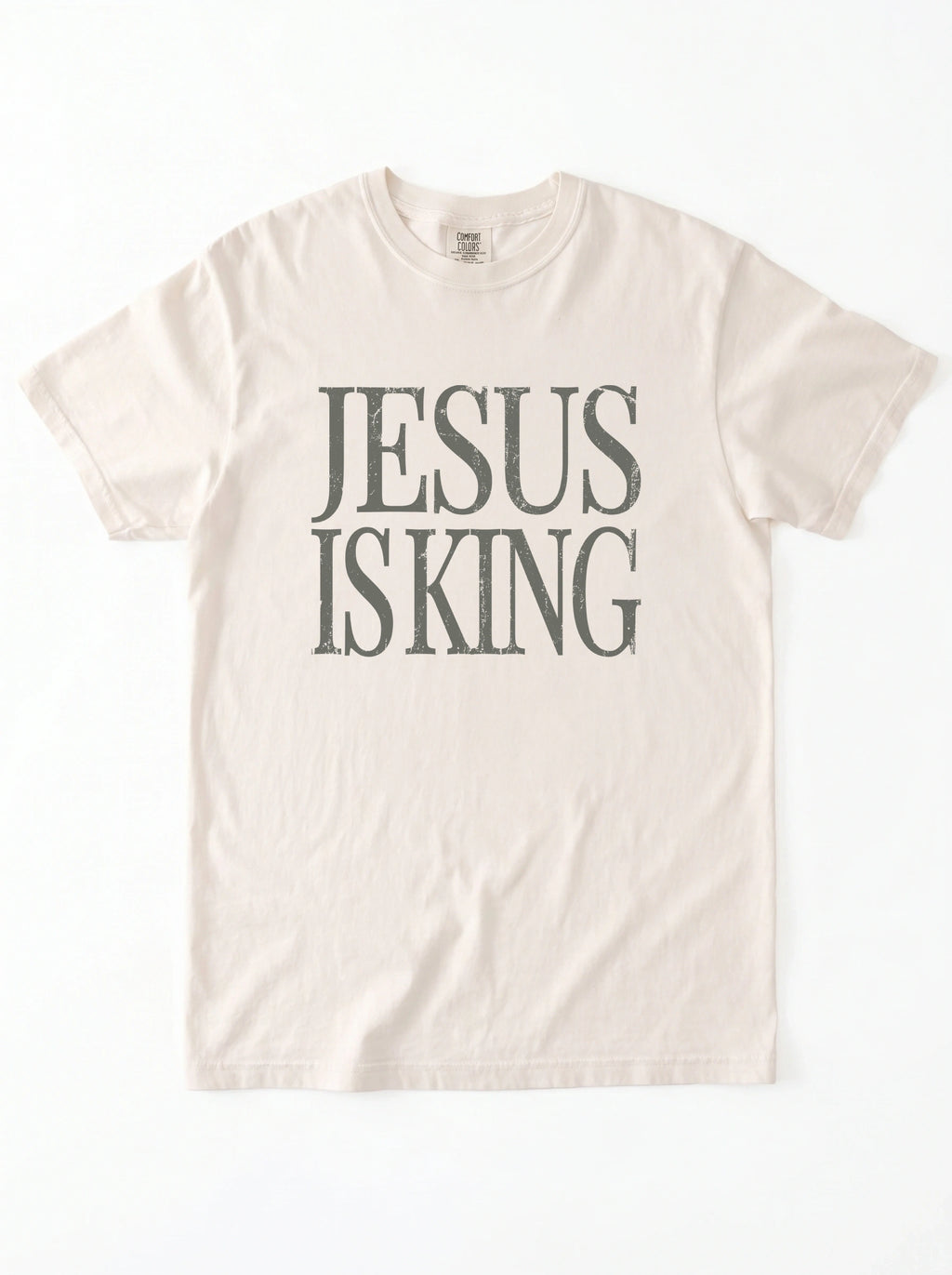 Flat lay of ivory Comfort Colors 1717 Jesus Is King graphic tee