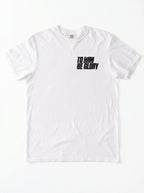White T-shirt laid flat with a distressed chest print reading “To Him Be Glory.”