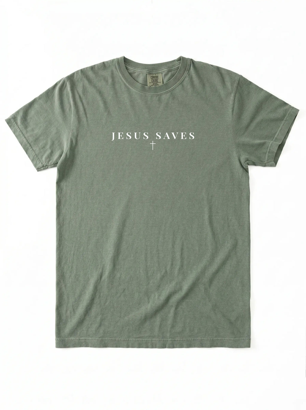 Sage green short-sleeve T-shirt laid flat on a white background, featuring white “JESUS SAVES” text with a small cross printed below.
