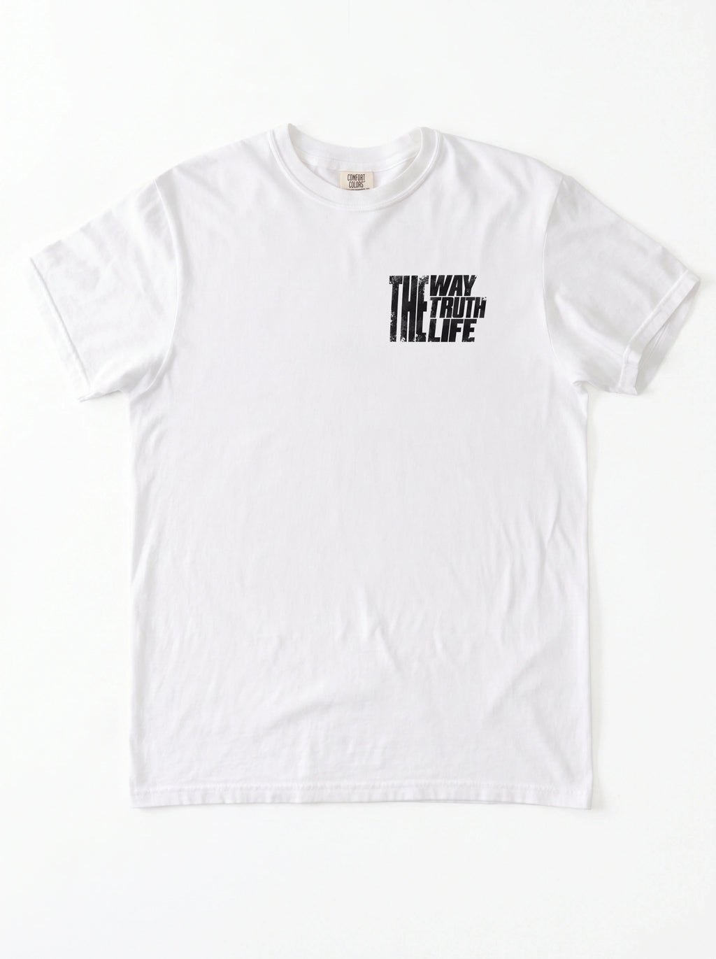 White T-shirt laid flat with a small distressed chest print reading “The Way The Truth The Life.”