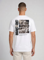 Person shown from behind wearing a white T-shirt with a grayscale Jesus graphic, vertical “Lord & Savior” text, and 2 Peter 3:18.