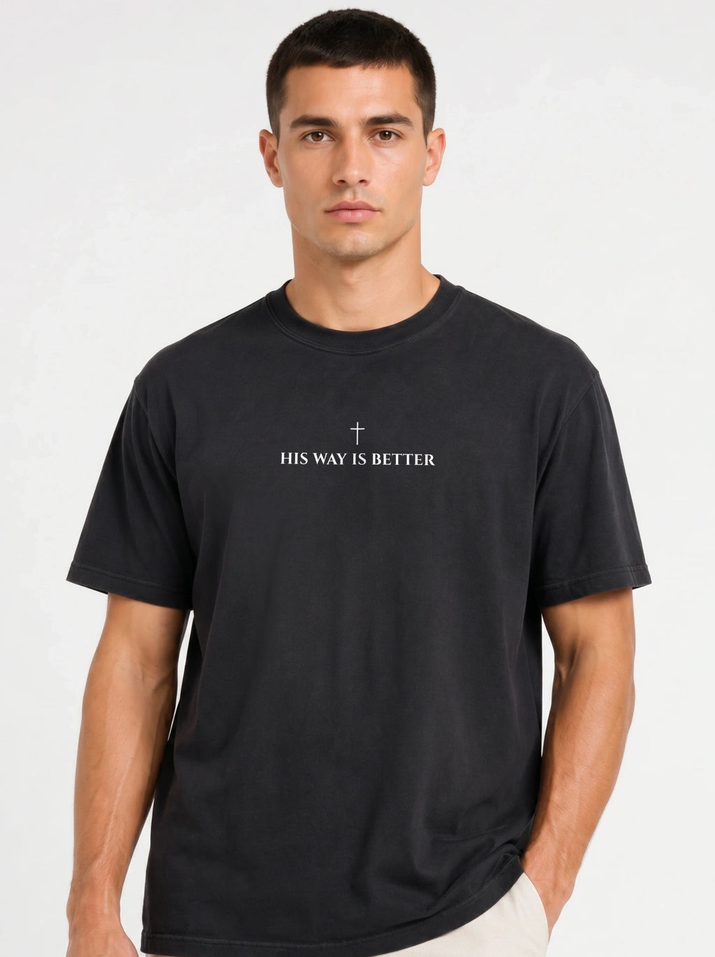 Person wearing a black T-shirt with a small cross above the text “His Way Is Better.”