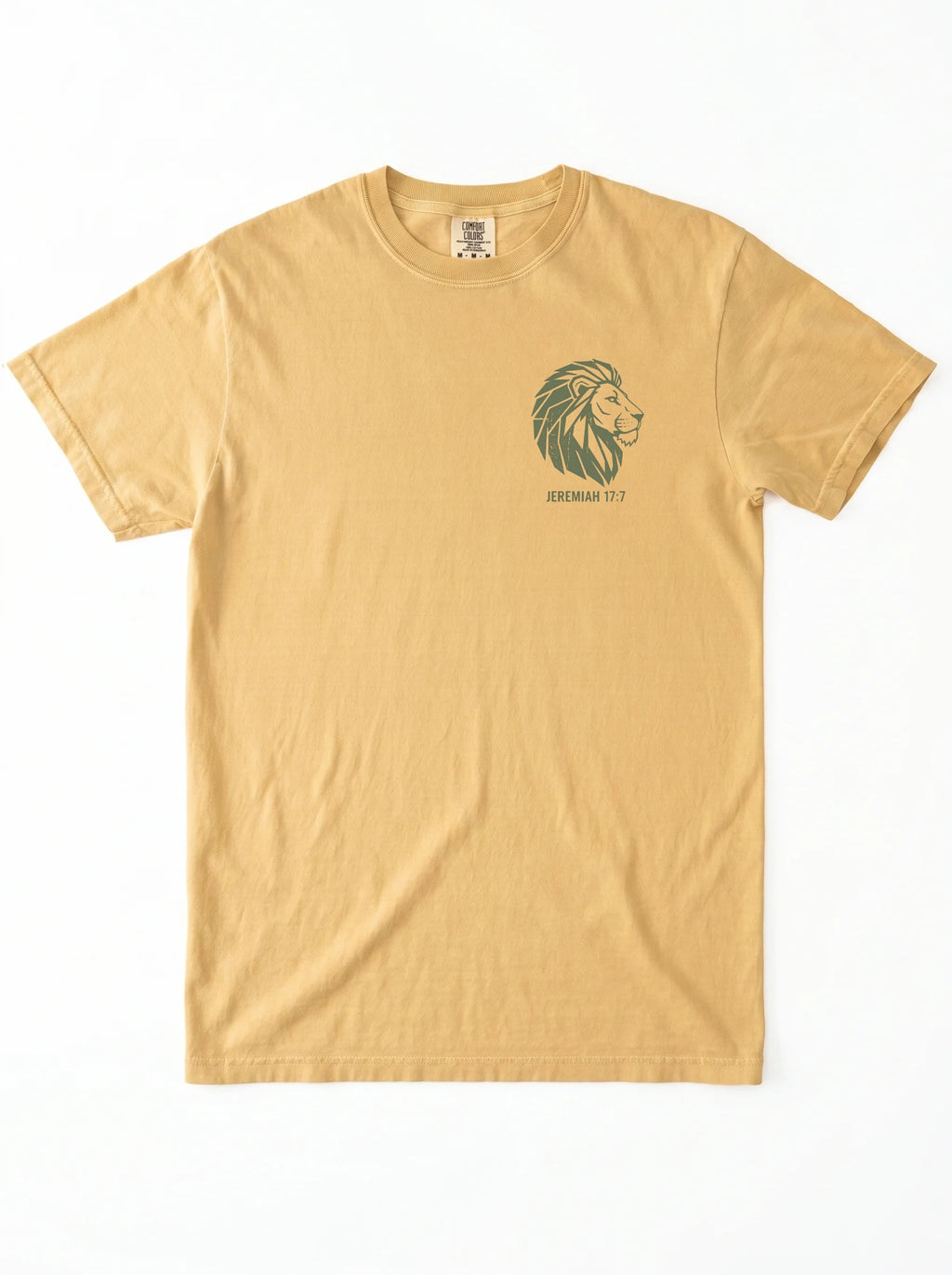 A light tan crewneck t-shirt featuring a dark green graphic of a green lion graphic and 'JEREMIAH 17:7' text on the left chest, displayed flat against a white background.