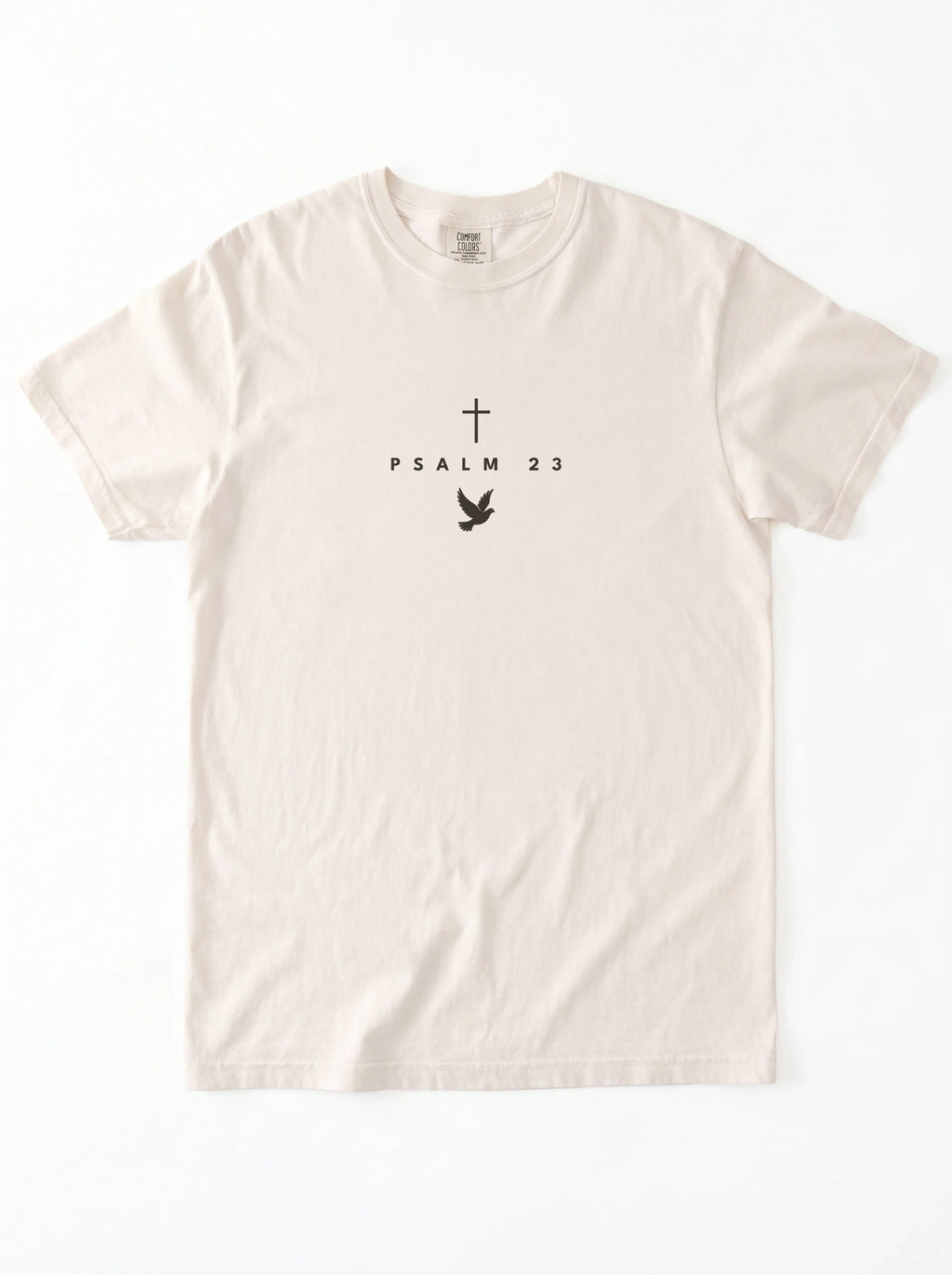 Cream T-shirt laid flat with a black cross, “PSALM 23” text, and dove graphic.