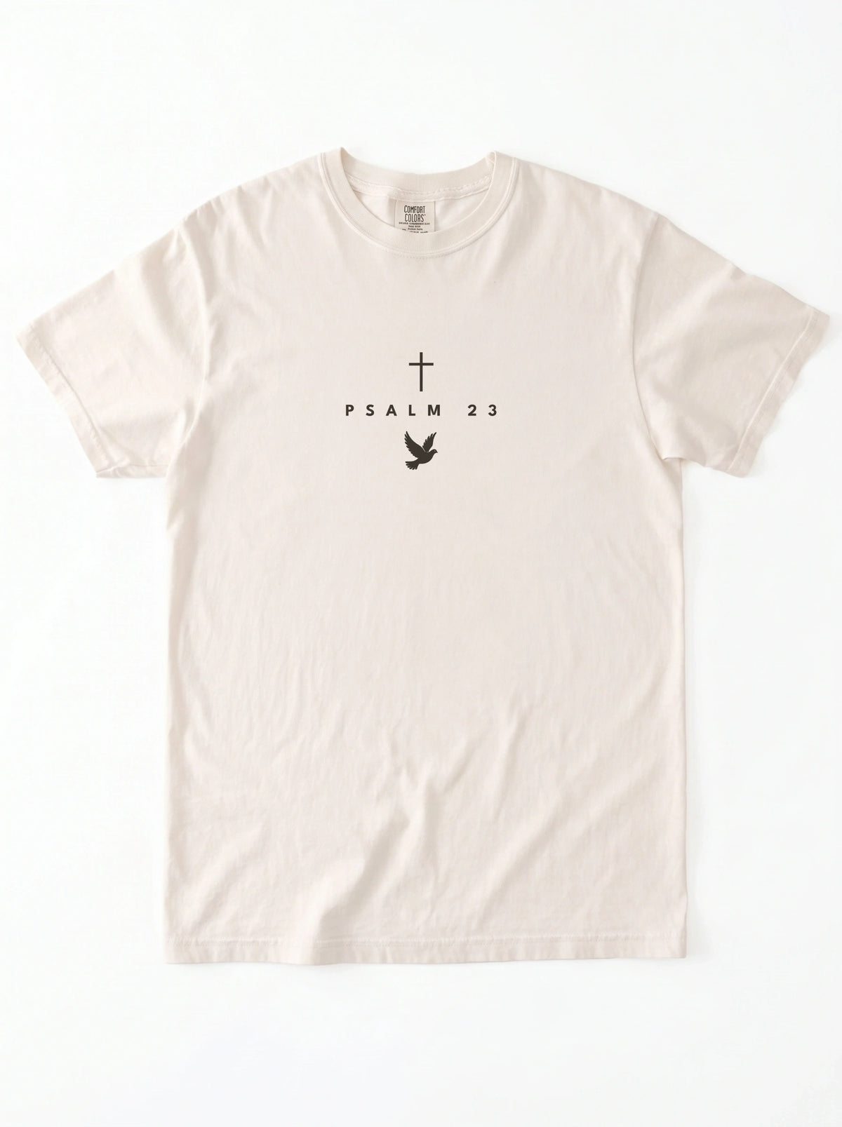 Cream T-shirt laid flat with a black cross, “PSALM 23” text, and dove graphic.