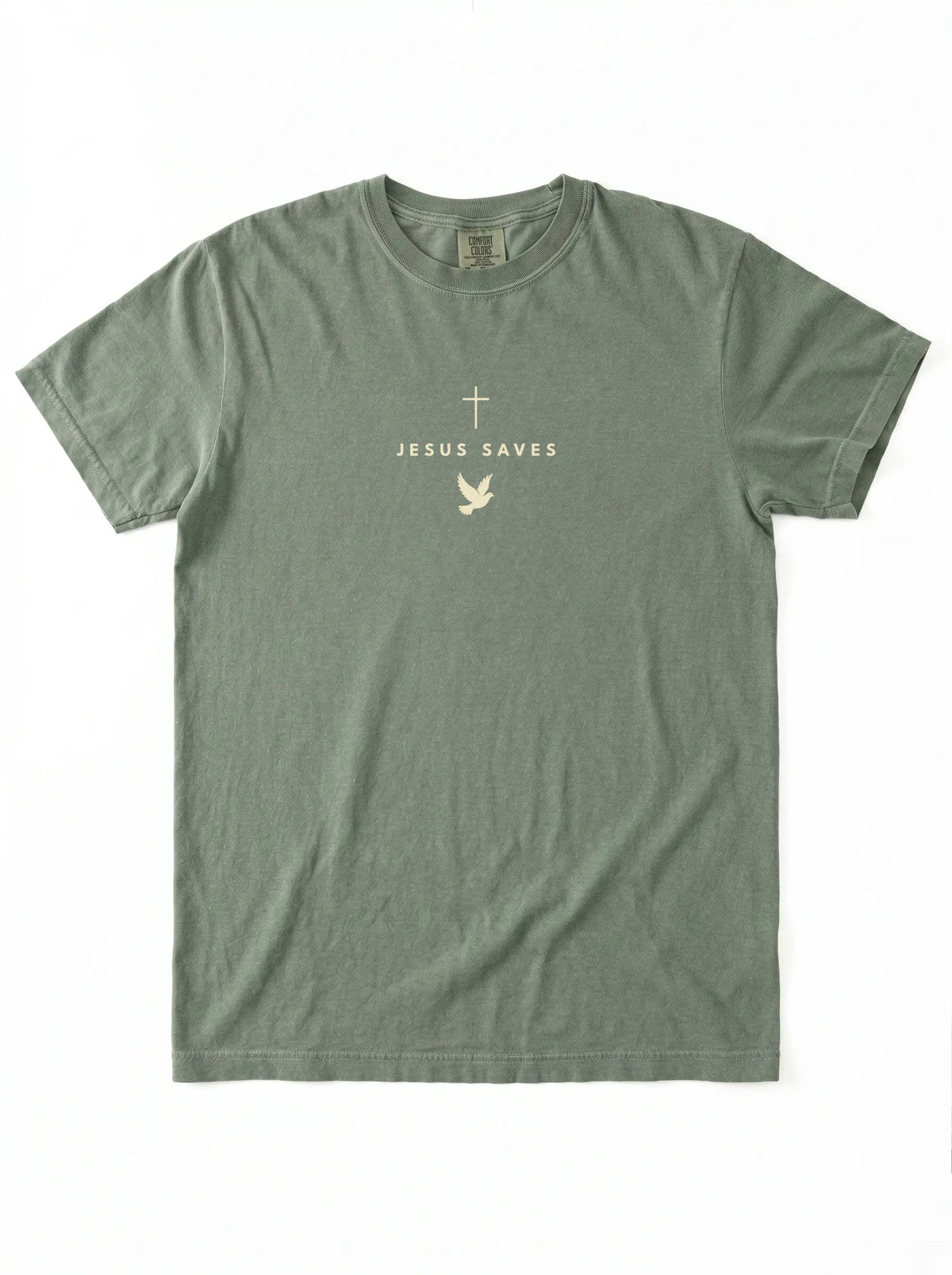 Faded green T-shirt laid flat with a light cross, “JESUS SAVES” text, and dove graphic.