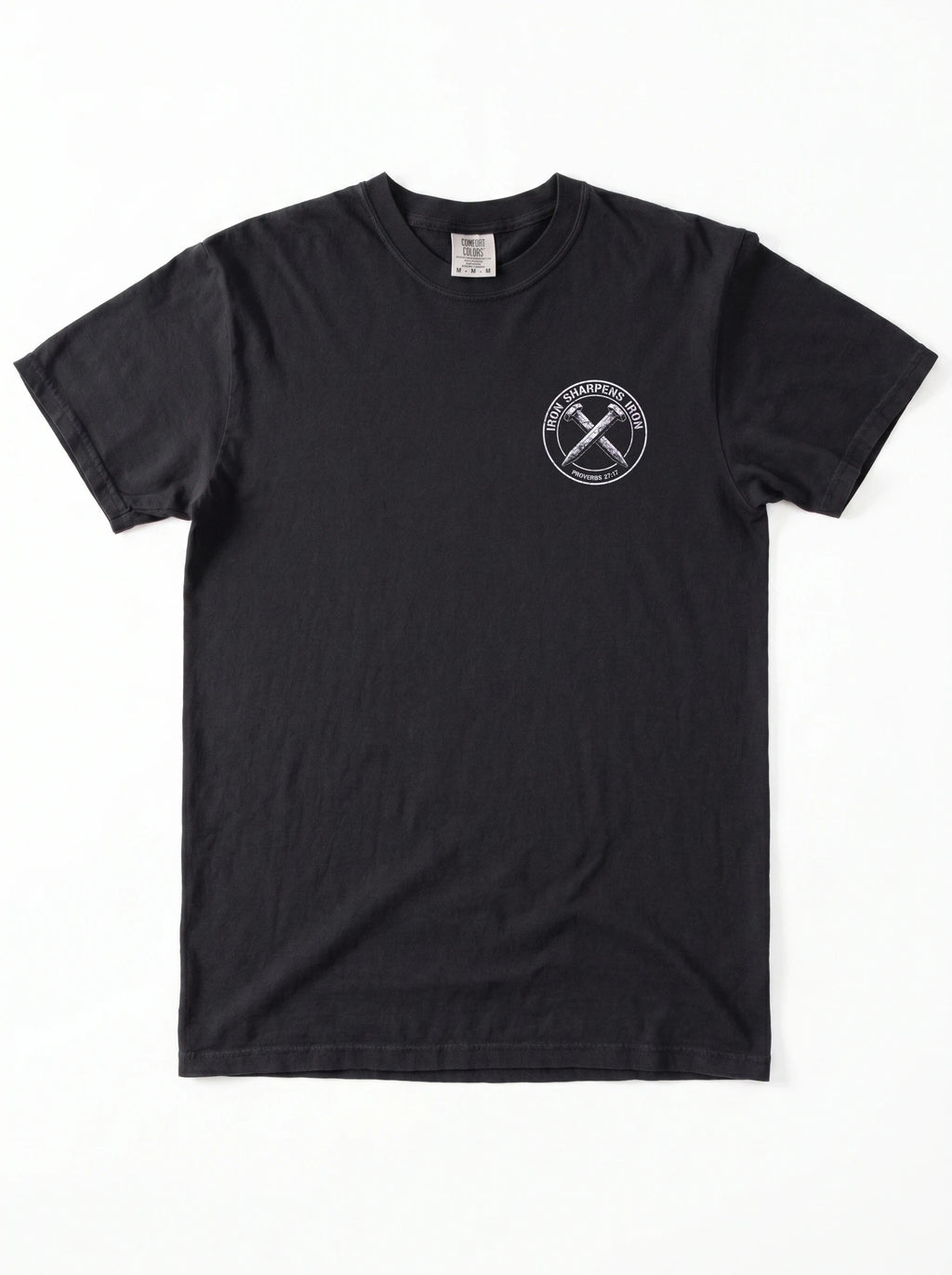 A black short-sleeve crewneck t-shirt with a white circular graphic on the left side of the chest with the text 'IRON SHARPENS IRON' and 'PROVERBS 27:17' surrounding an illustration of two crossed nails, displayed flat against a white background.