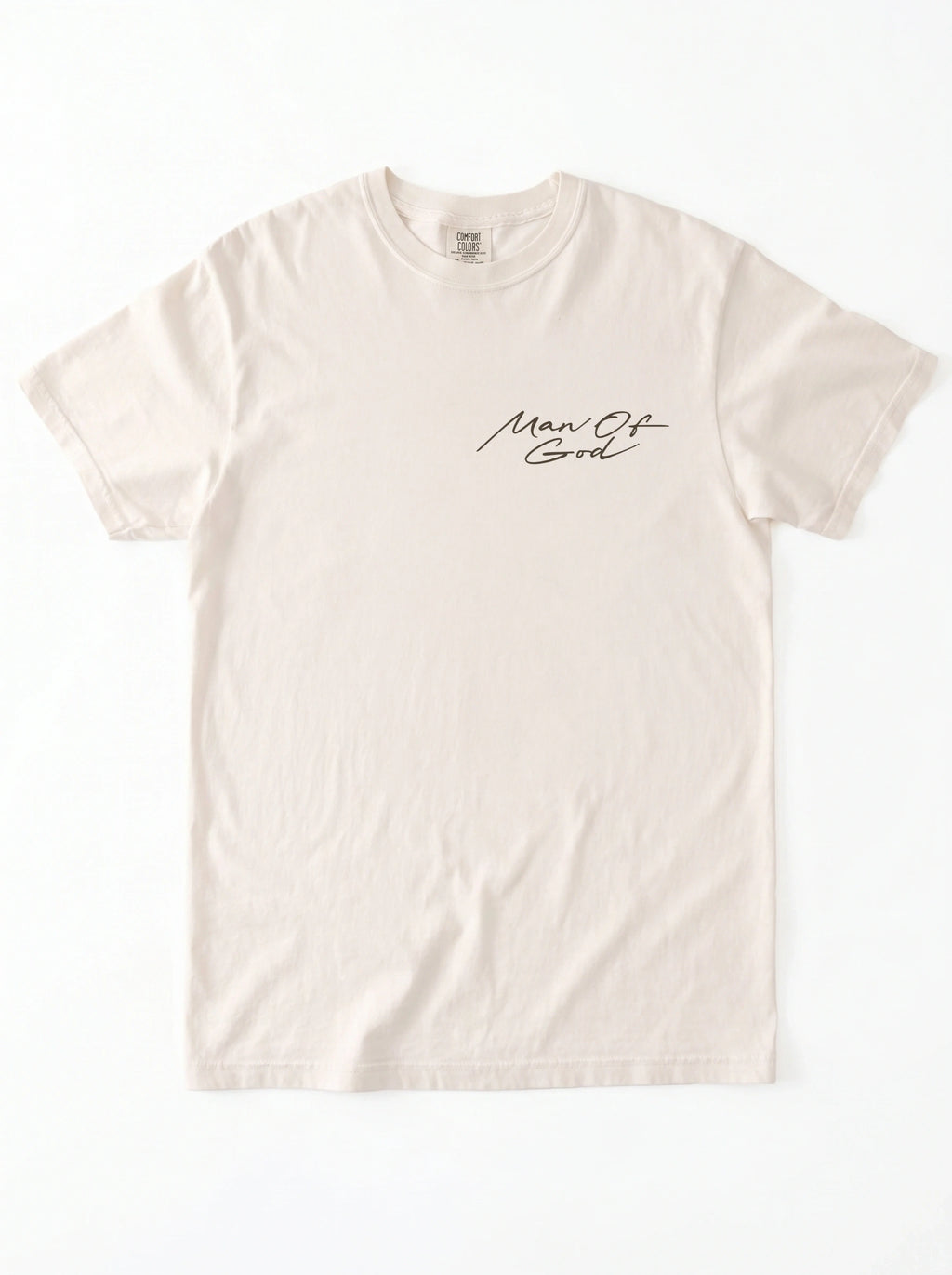 Cream T-shirt laid flat with a small black script chest graphic reading “Man Of God.”