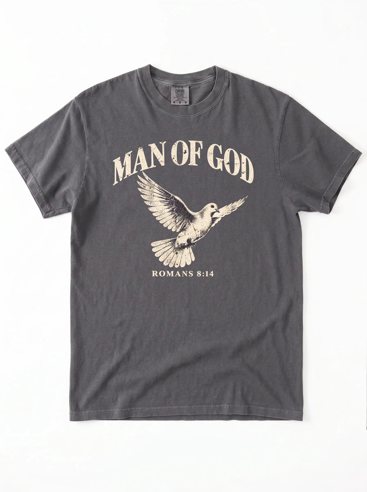 Charcoal T-shirt laid flat with a flying dove and the text “Man of God” and “Romans 8:14.”