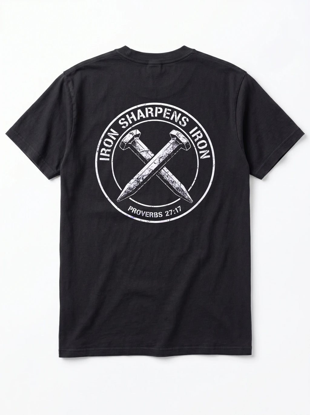 A black short-sleeve t-shirt shown from the back, featuring a large white circular graphic with crossed nails and the text 'IRON SHARPENS IRON' and 'PROVERBS 27:17'.