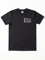 A black short-sleeve crewneck t-shirt with a 'King of Kings' printed in white Gothic lettering on the chest, displayed flat against a white background.