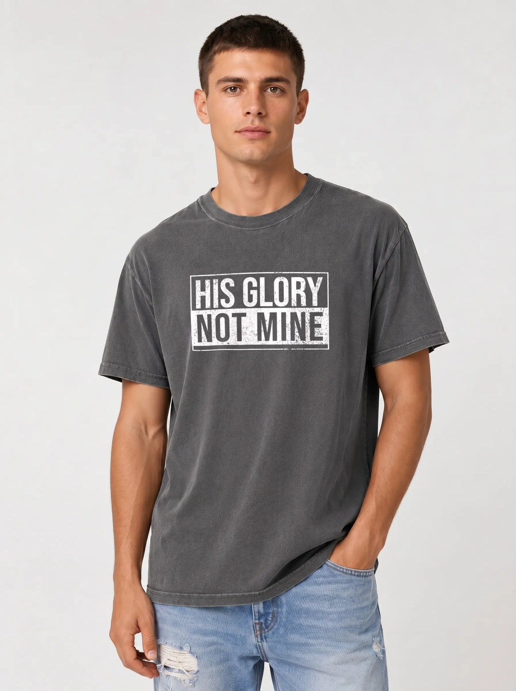 Man wearing gray His Glory Not Mine Comfort Colors t-shirt with jeans