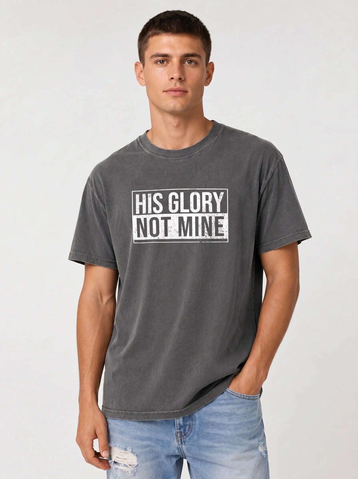 Man wearing gray His Glory Not Mine Comfort Colors t-shirt with jeans
