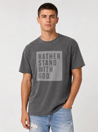 Man wearing pepper grey Comfort Colors t-shirt with Rather Stand With God quote graphic tee