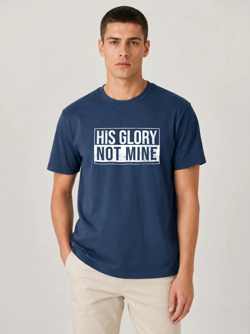 Man wearing navy His Glory Not Mine Comfort Colors t-shirt
